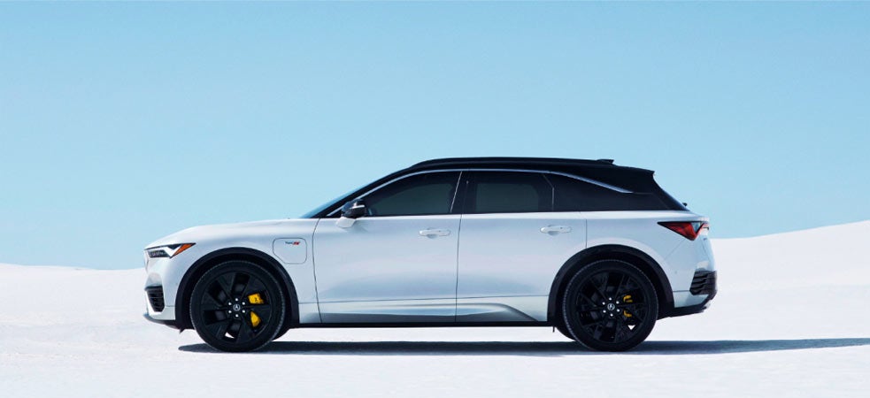 Side View of White Acura ZDX parked on bright white salt flats